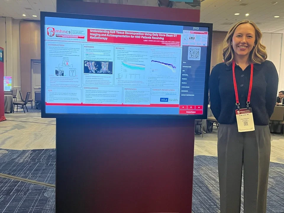 Erika presents her poster at MHNCS 2026.